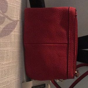 Brand new never worn new with tags!! Small red Wilson wristlet